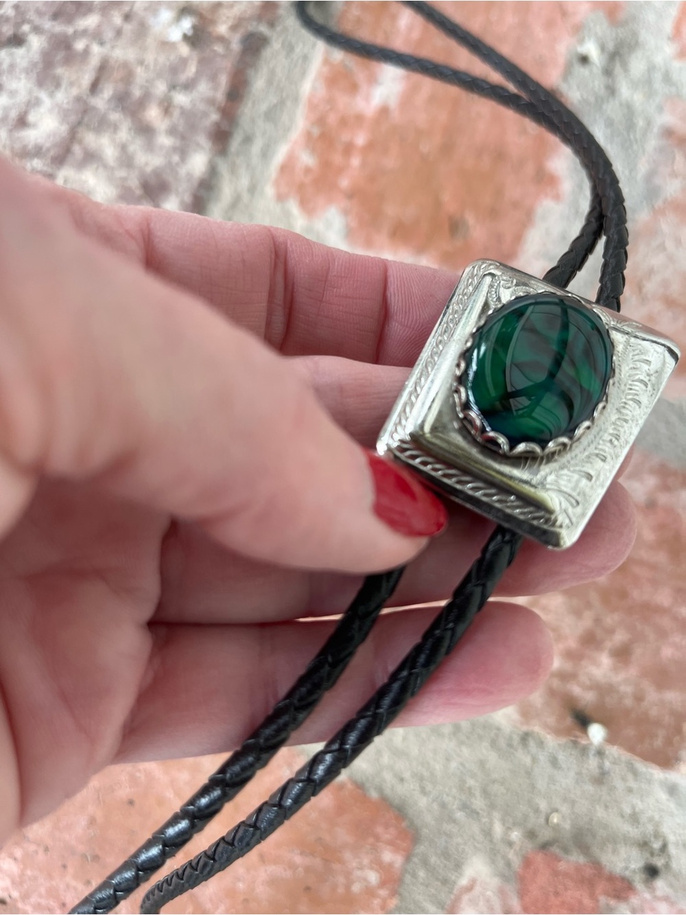 Western Bolo Tie featuring a deep Green gemstone.